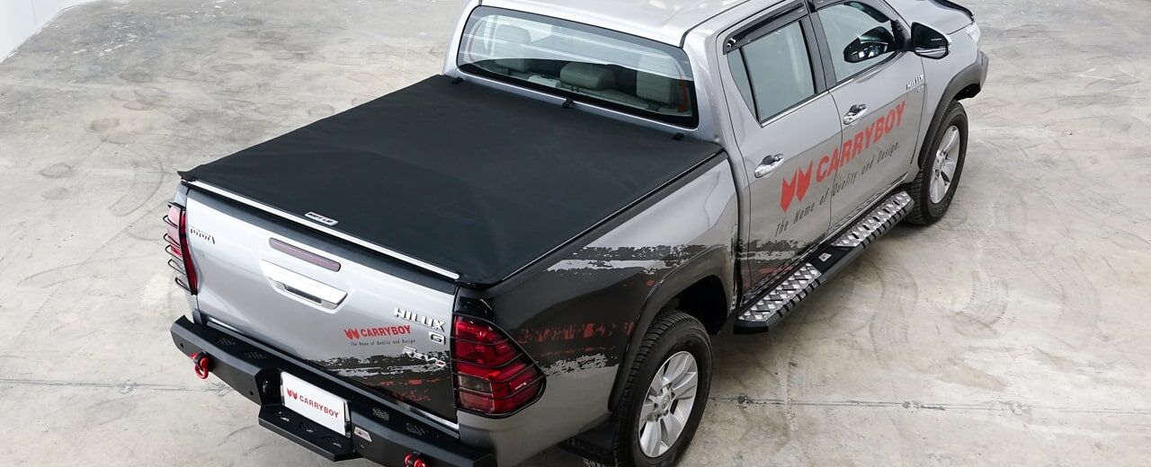 CARRYBOY Vinylplane Laderaumabdeckung Plane für Toyota Hilux Revo Extrakabine 2016+ dunkelgraue Vinylplane Toyota Hilux