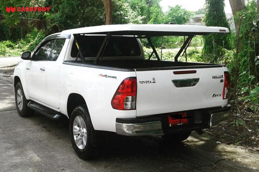 CARRYBOY Deckel in Wagenfarbe mit automatischem Motorhub Toyota Hilux Revo Invincible Extrakabine